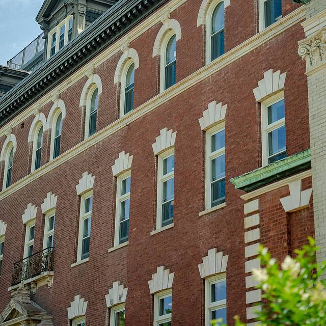 Aluminum windows in a brick building.