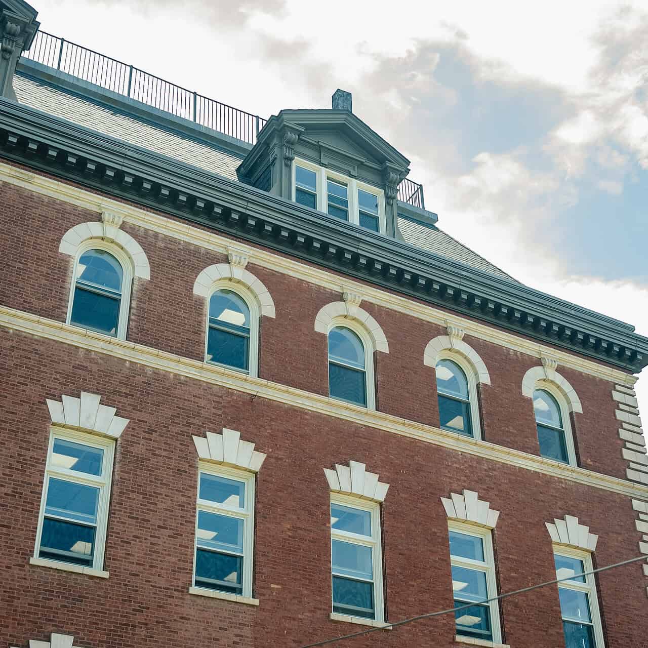 Aluminum windows in a brick building.